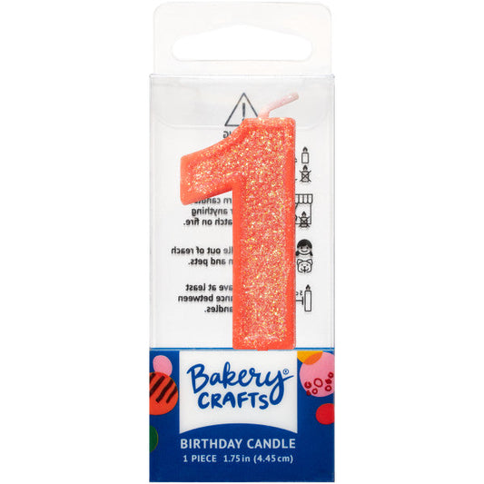 Glittery orange number one 1.75" birthday candle in packaging from Bakery Crafts.