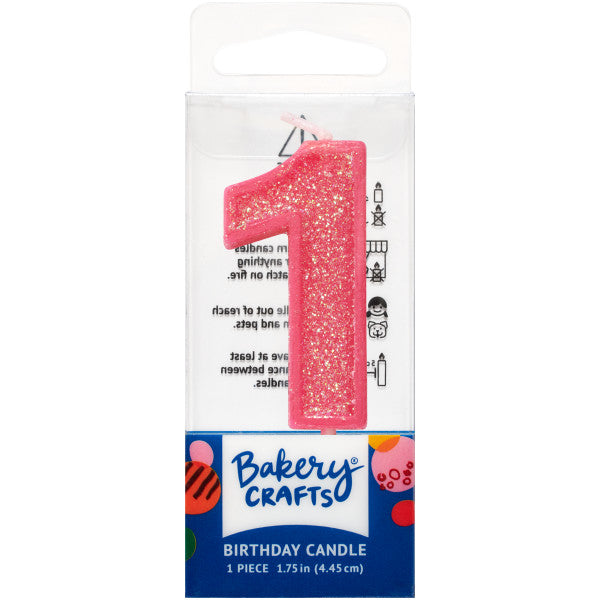Glittery pink number one 1.75" birthday candle in packaging from Bakery Crafts.