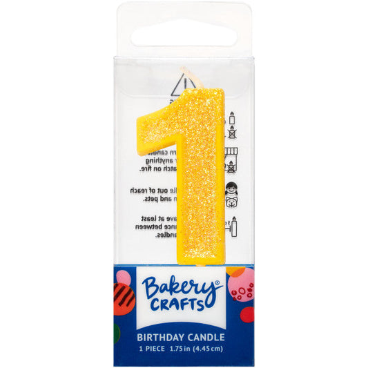 Glittery yellow number one 1.75" birthday candle in packaging from Bakery Crafts.