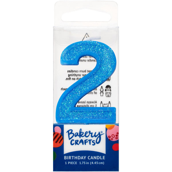 Glittery blue number two 1.75" birthday candle in packaging from Bakery Crafts.
