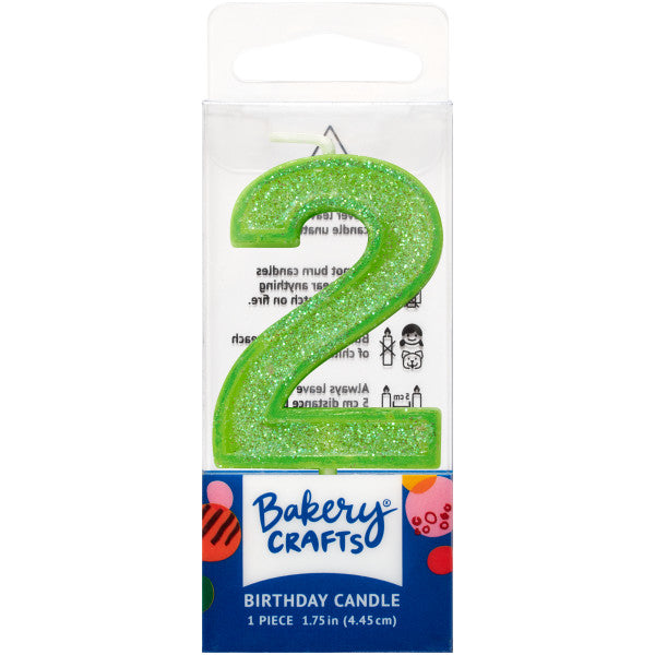 Glittery lime number two 1.75" birthday candle in packaging from Bakery Crafts.