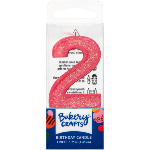Glittery pink number two 1.75" birthday candle in packaging from Bakery Crafts.