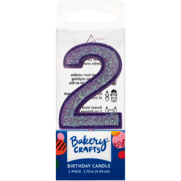 Glittery purple number two 1.75" birthday candle in packaging from Bakery Crafts.