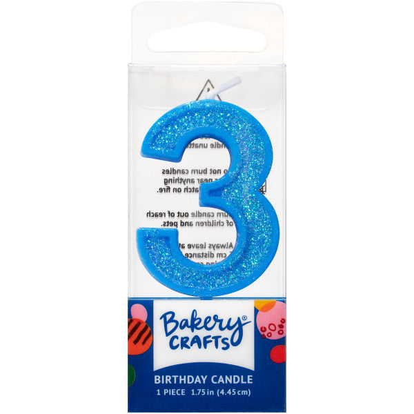 Glittery blue number three 1.75" birthday candle in packaging from Bakery Crafts.