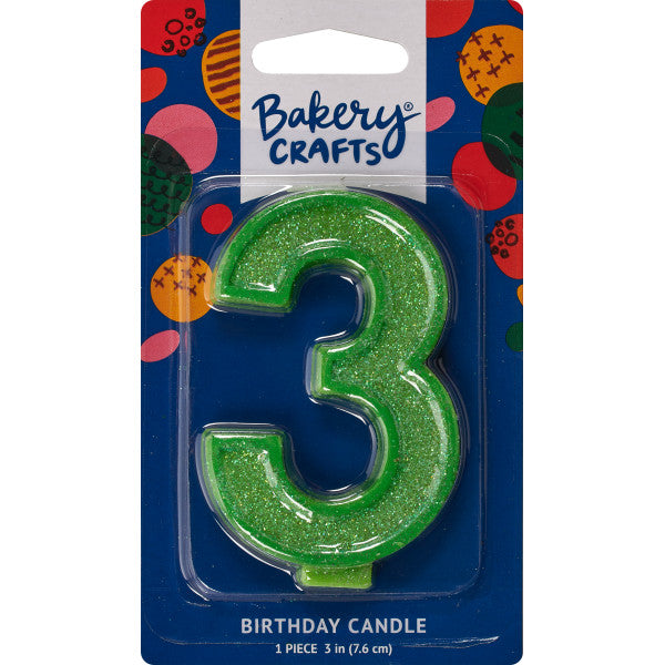 Glittery green number three 3" birthday candle in packaging from Bakery Crafts.