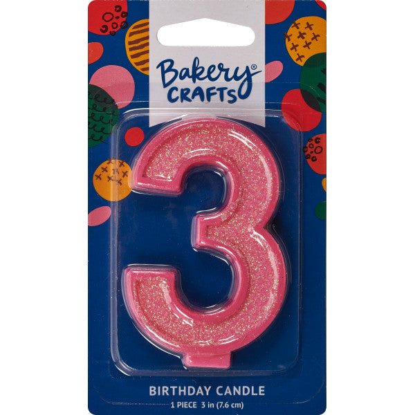 Glittery pink number three 3" birthday candle in packaging from Bakery Crafts.