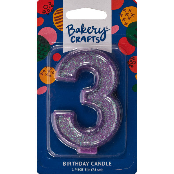 Glittery purple number three 3" birthday candle in packaging from Bakery Crafts.