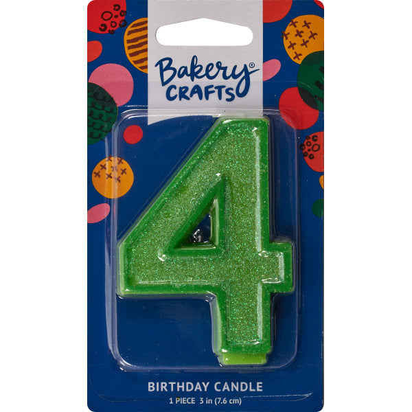 Glittery green number four 3" birthday candle in packaging from Bakery Crafts.