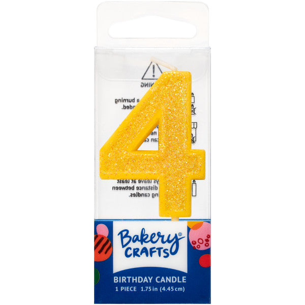 Glittery yellow number four 1.75" birthday candle in packaging from Bakery Crafts.