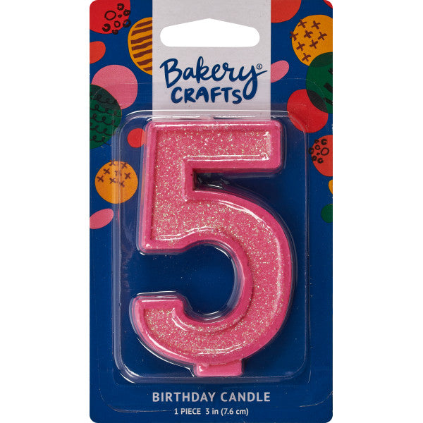 Glittery pink number five 3" birthday candle in packaging from Bakery Crafts.