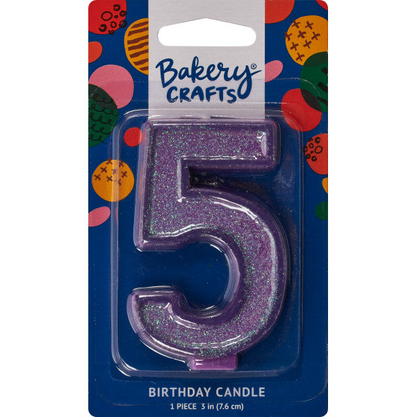 Glittery purple number five 3" birthday candle in packaging from Bakery Crafts.