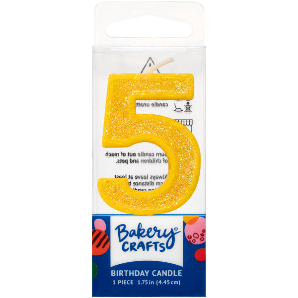 Glittery yellow number five 1.75" birthday candle in packaging from Bakery Crafts.
