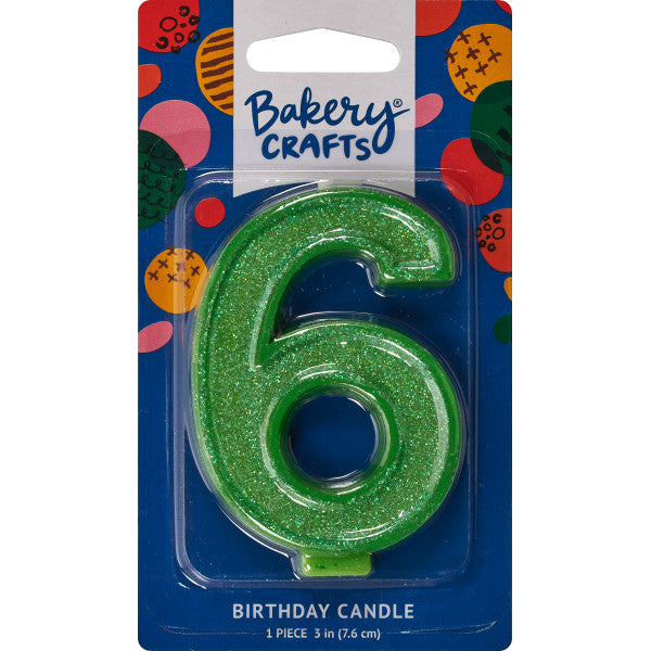 Glittery green number six 3" birthday candle in packaging from Bakery Crafts.