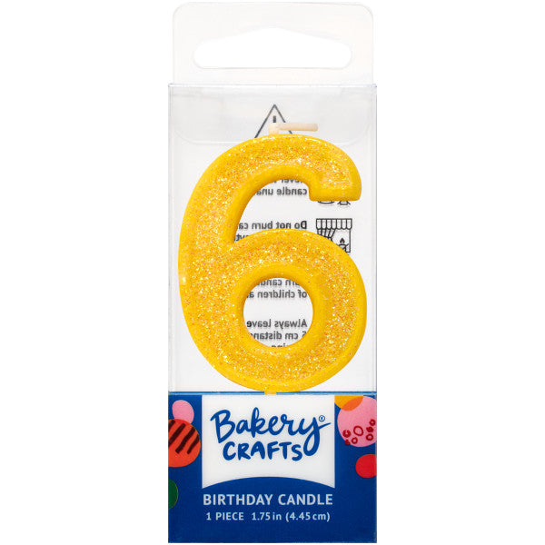 Glittery yellow number six 1.75" birthday candle in packaging from Bakery Crafts.