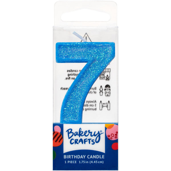 Glittery blue number seven 1.75" birthday candle in packaging from Bakery Crafts.