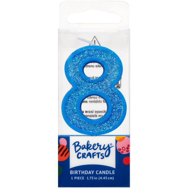 Glittery blue number eight 1.75" birthday candle in packaging from Bakery Crafts.