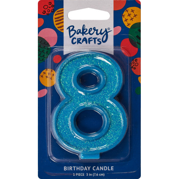 Glittery blue number eight 3" birthday candle in packaging from Bakery Crafts.