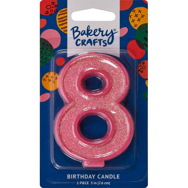 Glittery pink number eight 3" birthday candle in packaging from Bakery Crafts.