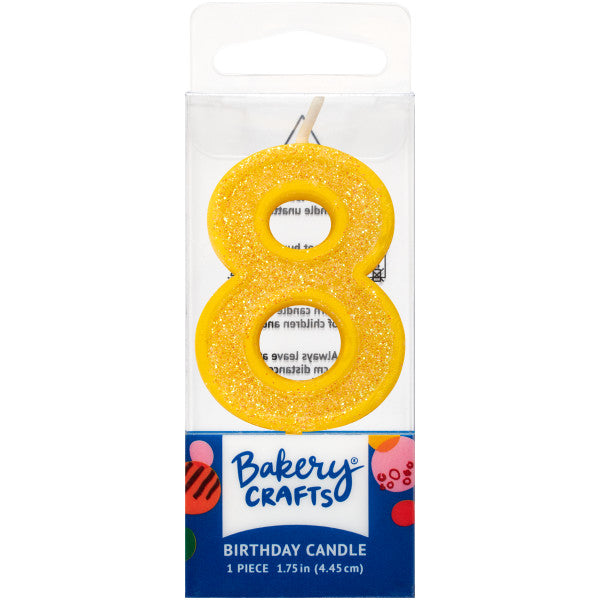 Glittery yellow number eight 1.75" birthday candle in packaging from Bakery Crafts.