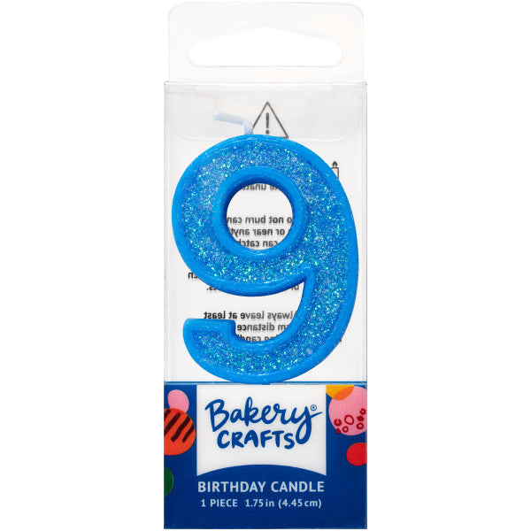 Glittery blue number nine 1.75" birthday candle in packaging from Bakery Crafts.