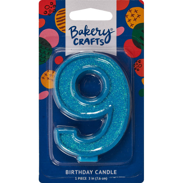 Glittery blue number nine 3" birthday candle in packaging from Bakery Crafts.