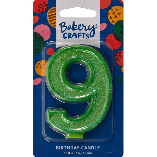 Glittery green number nine 3" birthday candle in packaging from Bakery Crafts.