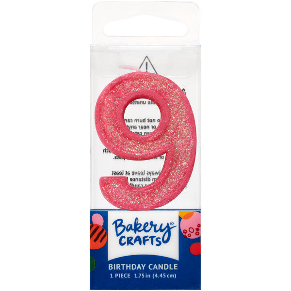 Glittery pink number nine 1.75" birthday candle in packaging from Bakery Crafts.
