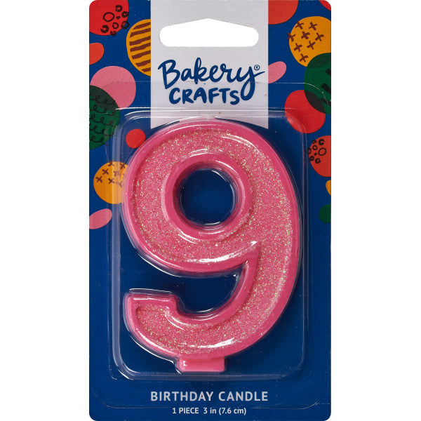 Glittery pink number nine 3" birthday candle in packaging from Bakery Crafts.