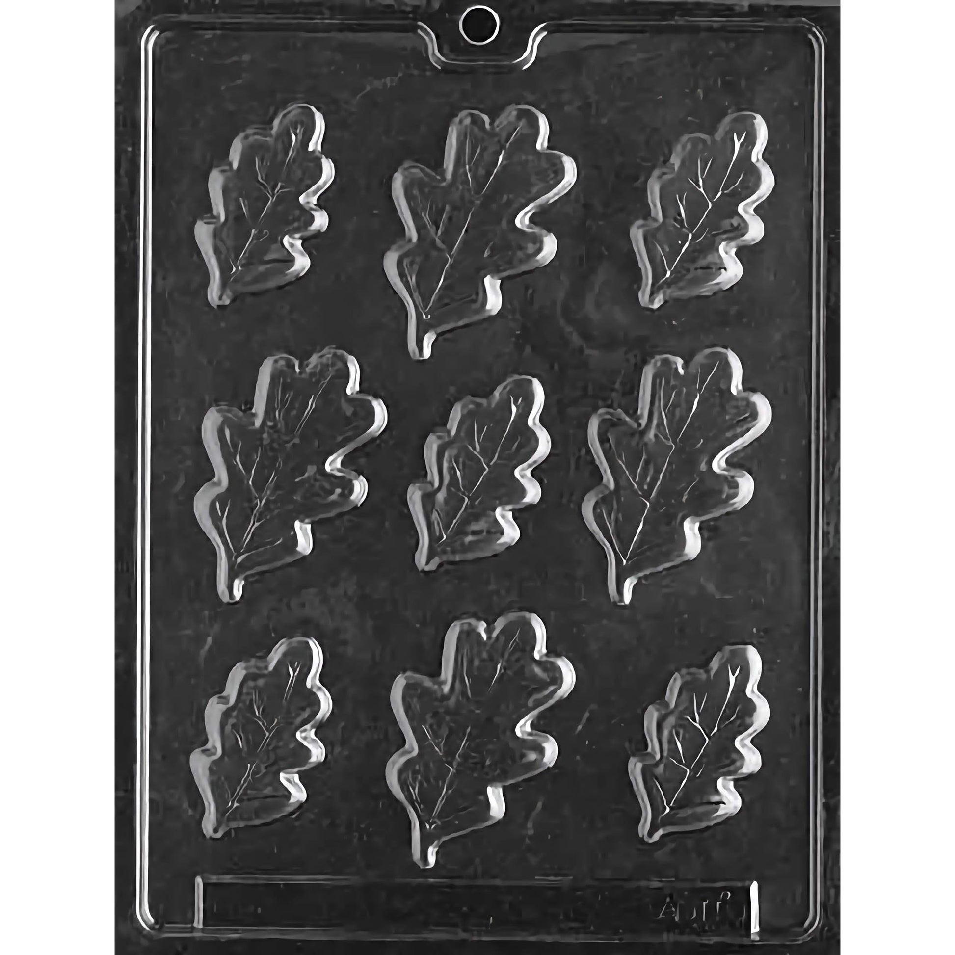 Clear plastic chocolate mold designed for making large oak leaf-shaped chocolates, featuring nine compartments arranged in three rows of three. Each compartment is intricately shaped like an oak leaf with detailed veining and edges.