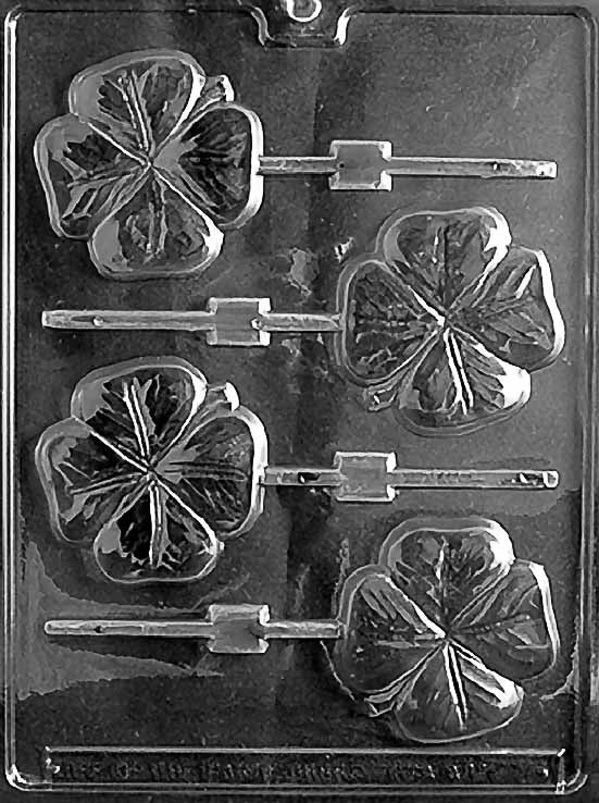 P002 SHAMROCK Lollipop chocolate mold with shamrock-shaped lollipop cavities featuring three-leaf outlines.