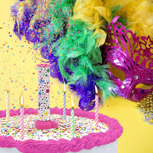 A birthday cake with candles and a Party Popper Cake Topper launching colorful edible confetti.