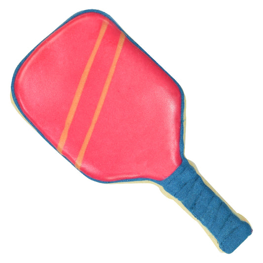 Decorated pickleball paddle cookie with a bright pink icing paddle face, thin orange stripes, and a blue icing handle on a white background.