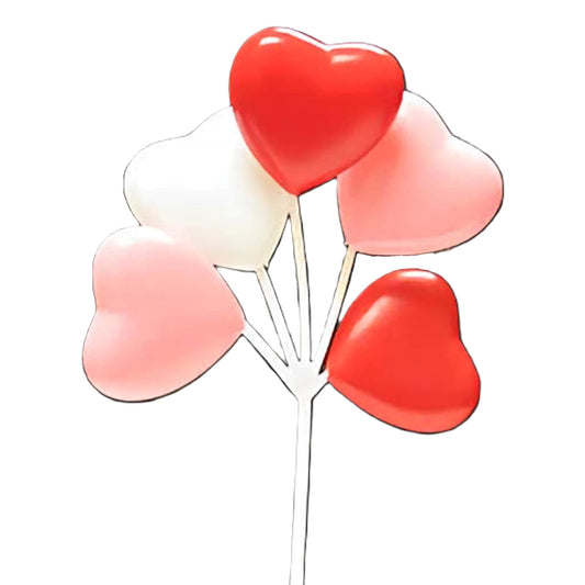 Cupcake pick featuring five heart-shaped balloons in red, pink, and white arranged in a bouquet style.