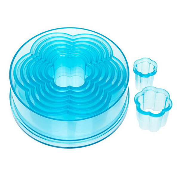 Ateco 5759 8-piece plain flower cutter set in transparent blue plastic, neatly nested in a round storage container with two cutters displayed separately.