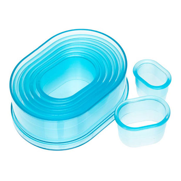 Ateco 5754 7-piece plain oval cutter set in transparent blue plastic, neatly nested in a round storage container with two cutters displayed separately.