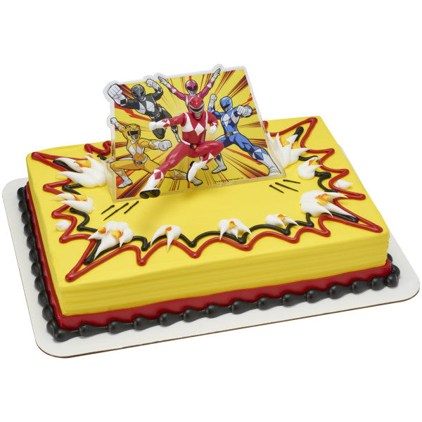 Yellow and red rectangular cake with Power Rangers Morphin Time topper, featuring Red Ranger kicking pose in front of dynamic comic-style background.