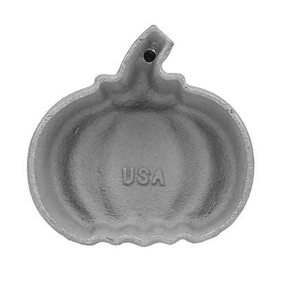Pumpkin-shaped cast aluminum rosette mold with detailed ridges and "USA" imprint inside.