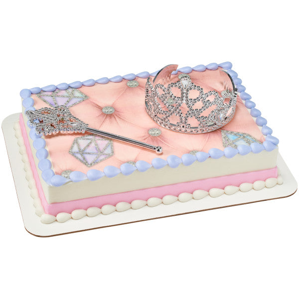 Rectangular cake decorated with a quilted pink pattern, diamonds, and princess toppers