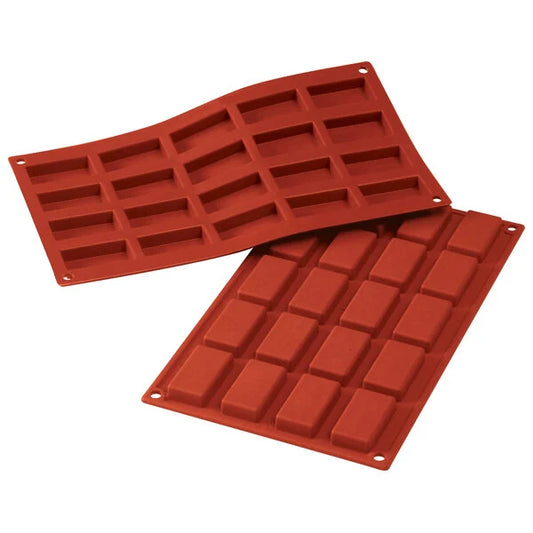Two red Silikomart SiliconFLEX SF025 silicone trays, one flexed and one flat, each with 20 small rectangular financier cavities; 12 x 7 in mold for baking or freezing.