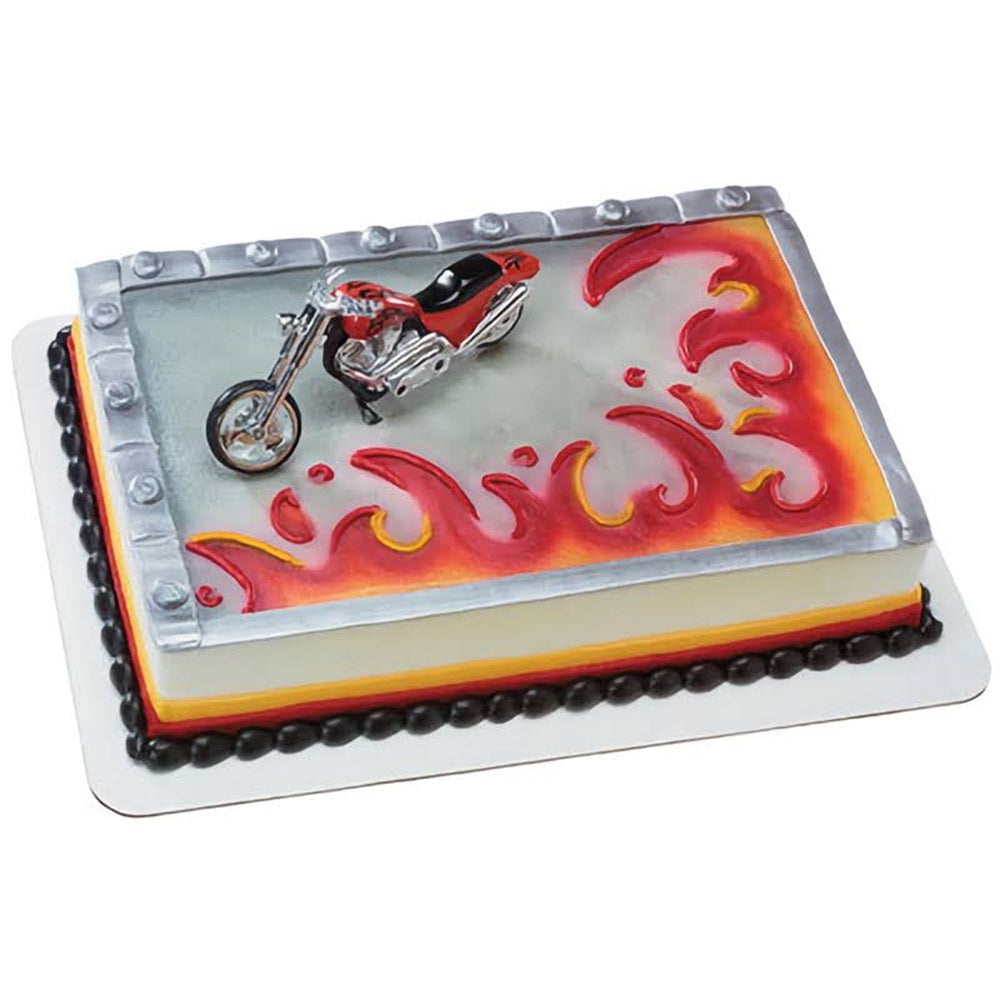 A sleek red chopper motorcycle cake topper, designed with intricate details and a shiny finish, perfect for any motorcycle enthusiast's cake. This topper is a unique find at Lynn's Cake, Candy, and Chocolate Supplies for adding a cool, adventurous flair to your celebration.