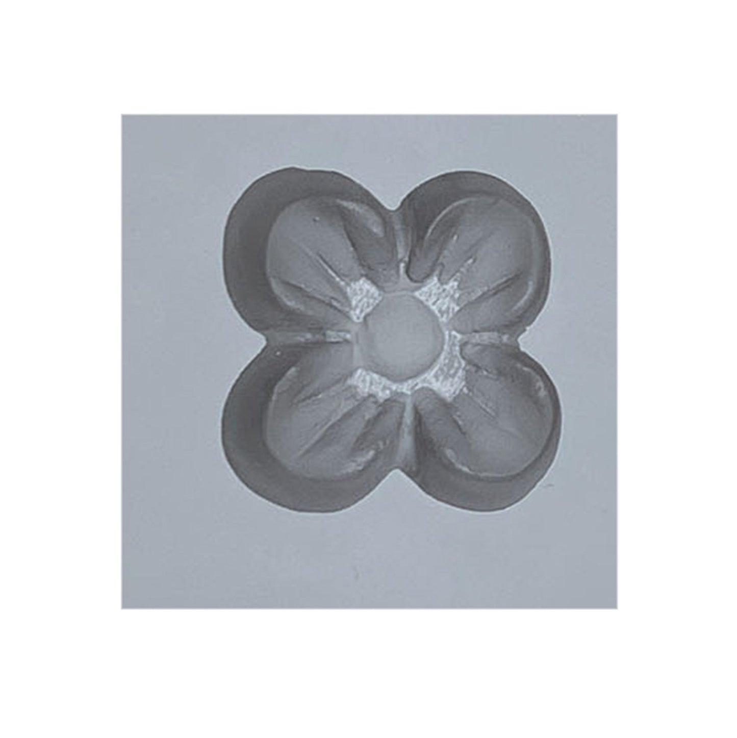 Close-up of a single cavity from the Small Dogwood Flower Rubber Mint Mold, showing a four-petal flower shape ideal for creating dogwood-shaped mints or candies.