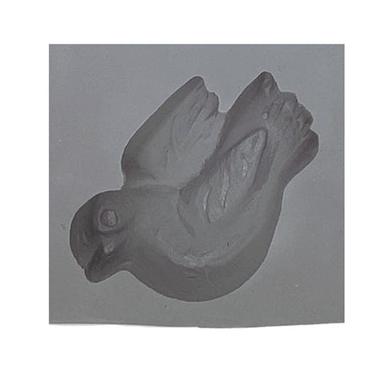 Close-up of a single cavity from the Dove Rubber Mint Mold, featuring a realistic dove design with defined wings and a peaceful expression—ideal for themed candies or mints.