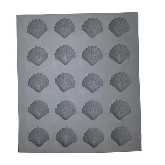 Full sheet of 20 shell-shaped rubber mint mold cavities arranged in a grid, used for crafting ocean-inspired sweets.