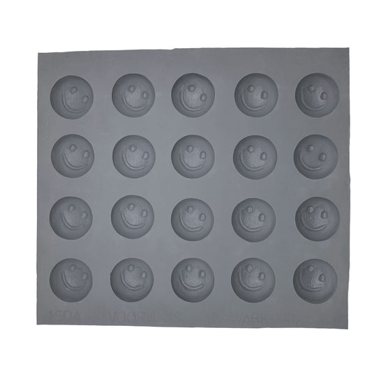 Full sheet of 20 smiley face rubber mint mold cavities arranged in neat rows