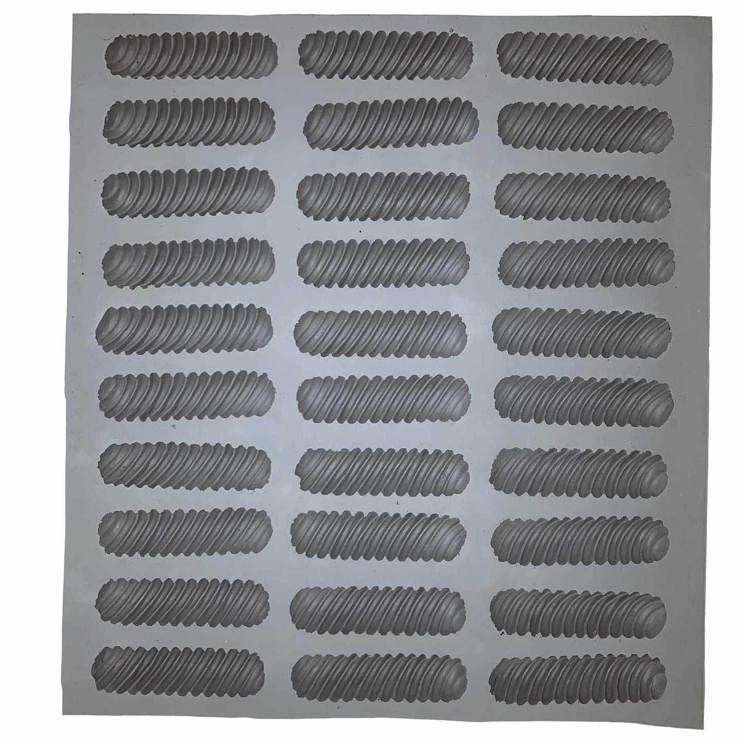 Full sheet of spiral rubber mint molds featuring multiple cavities for making twisted mints, chocolates, or fondant pieces