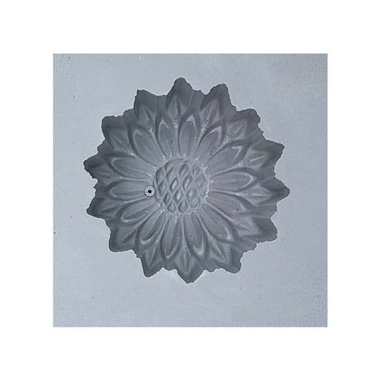 Close-up view of a single cavity from the Large Daisy or Sunflower Rubber Mint Mold, showcasing detailed flower petals and a textured center for candy making.