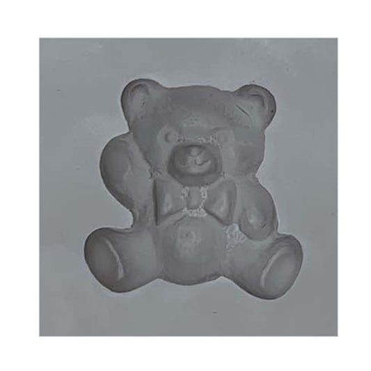 Close-up of a teddy bear-shaped cavity in a natural rubber mint mold, ideal for creating mints, chocolates, or baby shower-themed confections.