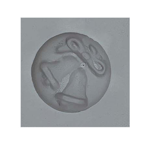 Close-up of a single cavity from the Wedding Bells Rubber Mint Mold, featuring a detailed design with two bells and a bow, perfect for wedding-themed mints or chocolates.
