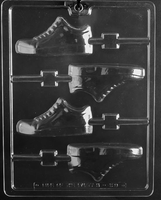 Gym Sneaker Lollipop chocolate mold with lollipop cavities shaped like sneakers; clear sheet with stick channel.