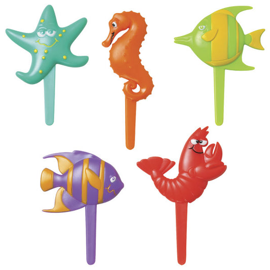 Set of five plastic sea life cupcake picks featuring a red shrimp, orange seahorse, green starfish, and two tropical fish in green-yellow and purple-yellow.